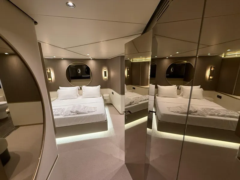 Slide: The Image of Luxurious bedroom interior of 2026 Azimut Magellano 25M yacht with modern design and ambient lighting. - 17