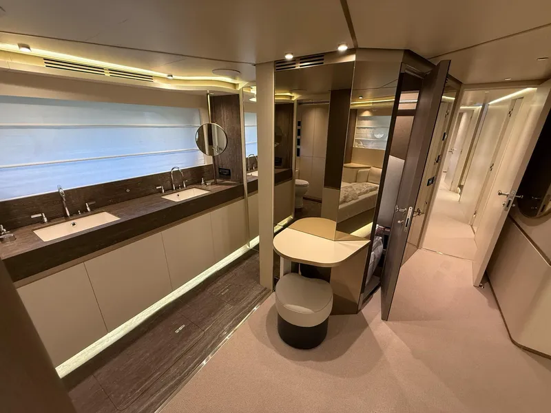 Slide: The Image of Luxurious interior of 2026 Azimut Magellano 25M yacht featuring modern bathroom and vanity area. - 22