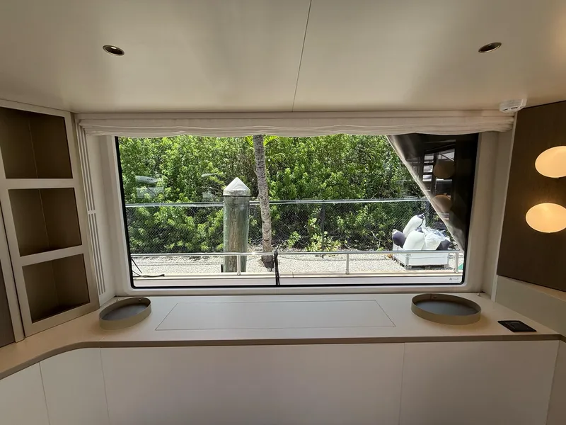 Slide: The Image of Interior view of 2026 Azimut Magellano 25M yacht, featuring large window and modern design. - 34