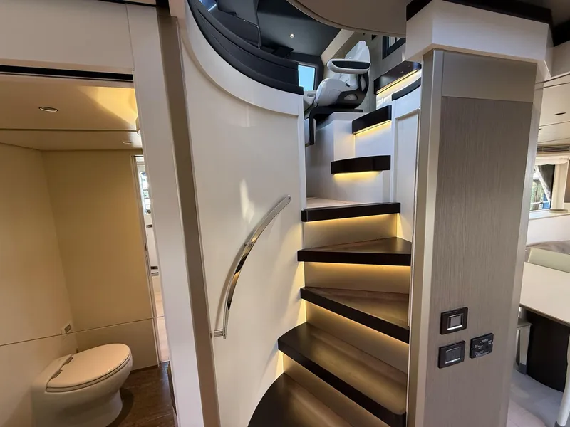 Slide: The Image of Luxurious interior of 2026 Azimut Magellano 25M yacht with modern staircase and elegant design. - 39