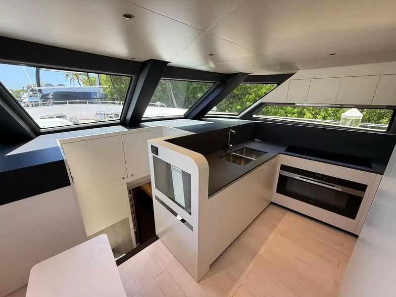 Slide: The Image of Modern kitchen interior of 2026 Azimut Magellano 25M yacht with sleek design and large windows. - 40