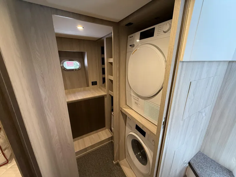 Slide: The Image of Laundry area in 2026 Azimut Magellano 25M yacht with washer and dryer. - 49