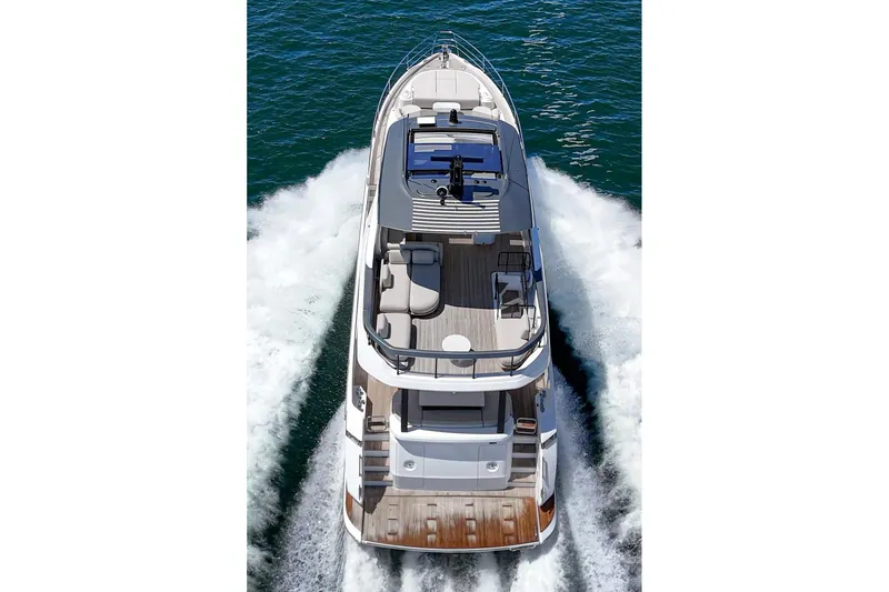 Slide: The Image of Azimut Fly 72 yacht cruising on open water, aerial view, 2026 model. - 12