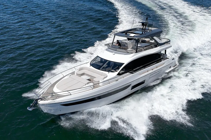 Slide: The Image of 2026 Azimut Fly 72 yacht cruising on open water, showcasing sleek design and luxury. - 16