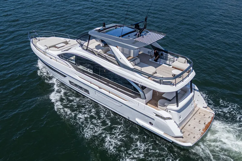 Slide: The Image of 2026 Azimut Fly 72 luxury yacht cruising on open water, aerial view. - 20