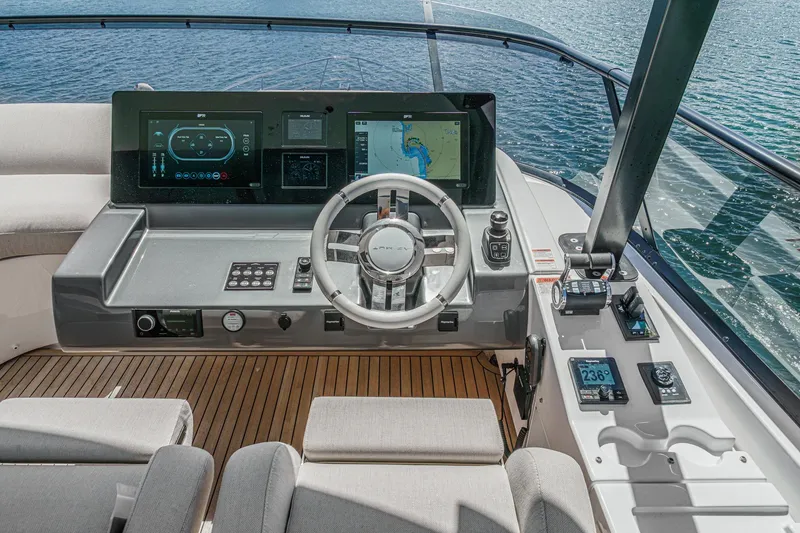 Slide: The Image of Helm of 2026 Azimut Fly 72 yacht with advanced navigation systems and luxurious seating. - 32