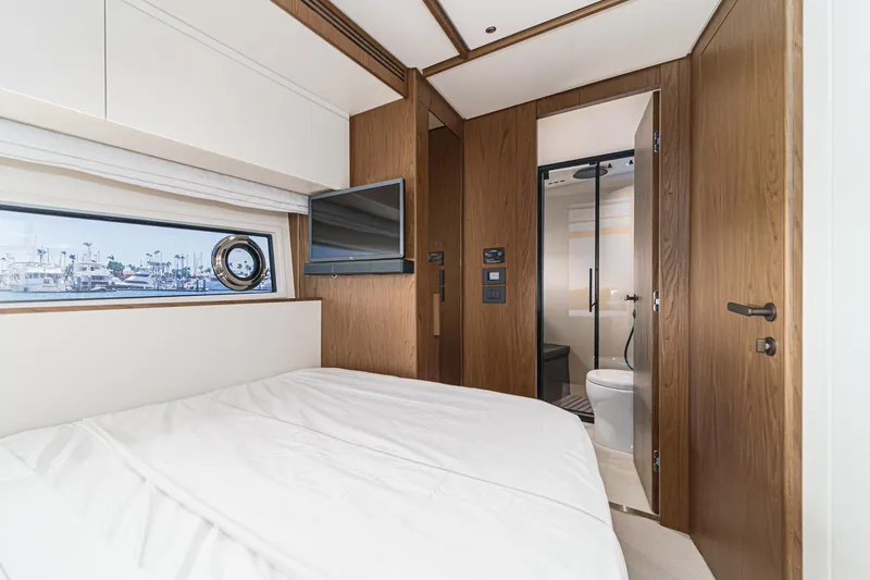 Slide: The Image of Luxurious bedroom and bathroom in 2026 Azimut Fly 72 yacht, featuring modern design and amenities. - 65
