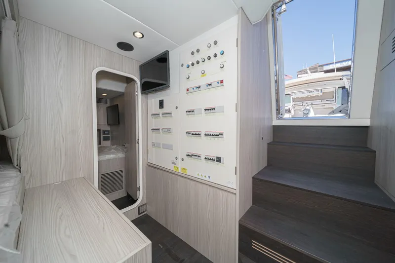 Slide: The Image of Interior of 2026 Azimut Fly 72 yacht, featuring control panels and modern design. - 71