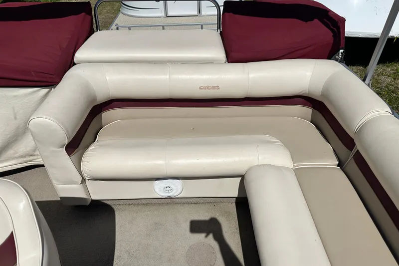 Slide: The Image of 1999 Crest 25 III Classic boat interior with beige and maroon seating. - 10