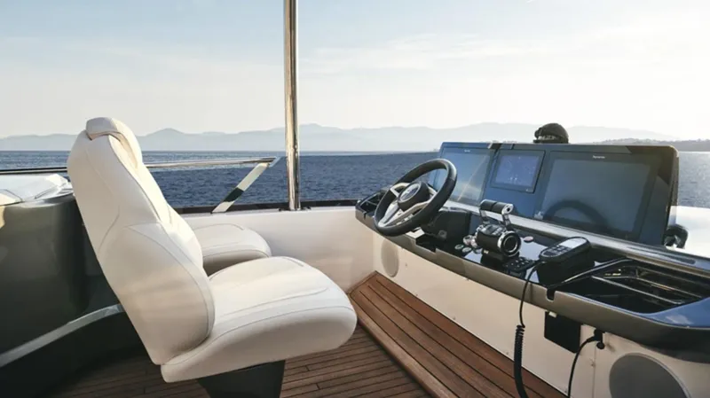 Slide: The Image of Luxury yacht helm of 2025 Princess F65, featuring modern controls and ocean view. - 8