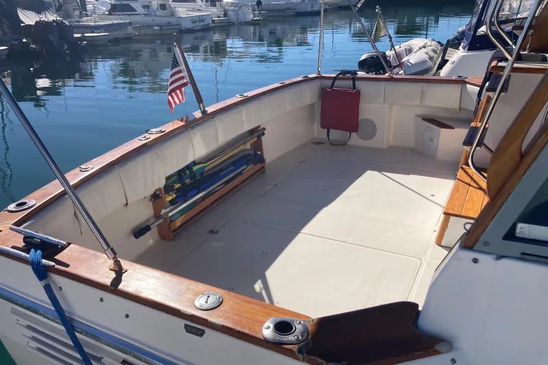 Slide: The Image of 1989 Bayliner 3288 Motoryacht interior with wooden steps and sink area. - 10