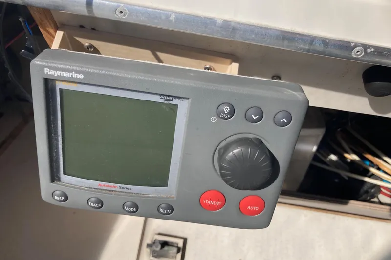 Slide: The Image of 1989 Bayliner 3288 Motoryacht dashboard with Garmin GPSmap 182C and Furuno navigation devices. - 15