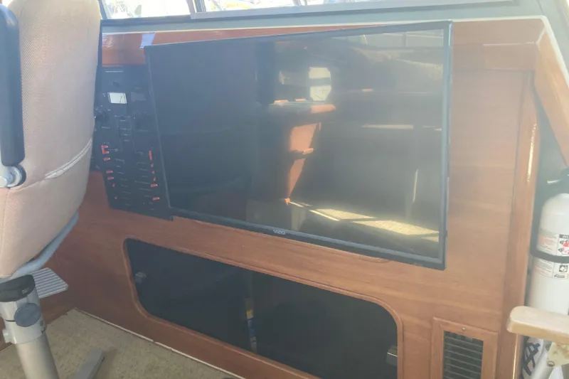 Slide: The Image of Interior of 1989 Bayliner 3288 Motoryacht with TV and control panel. - 24