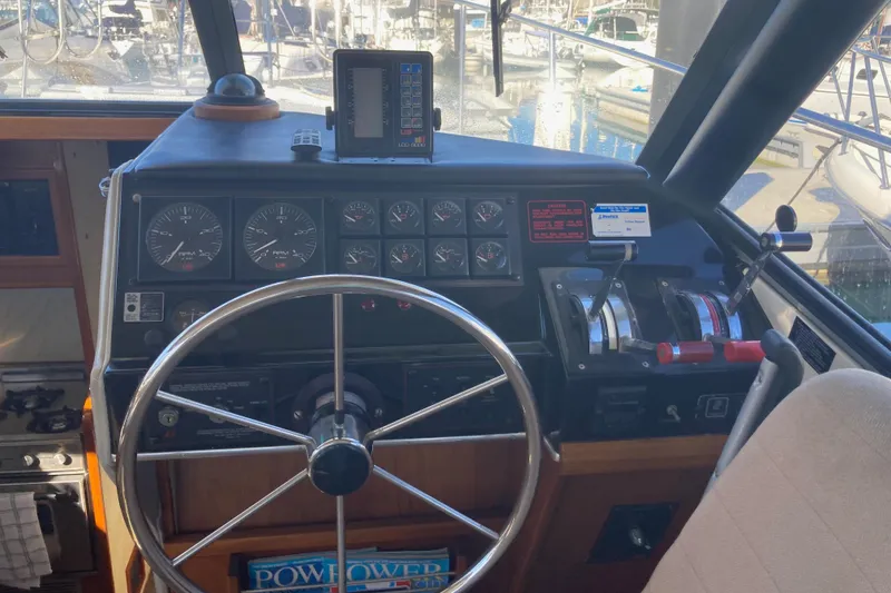 Slide: The Image of Cockpit of 1989 Bayliner 3288 Motoryacht with steering wheel and control panel. - 26
