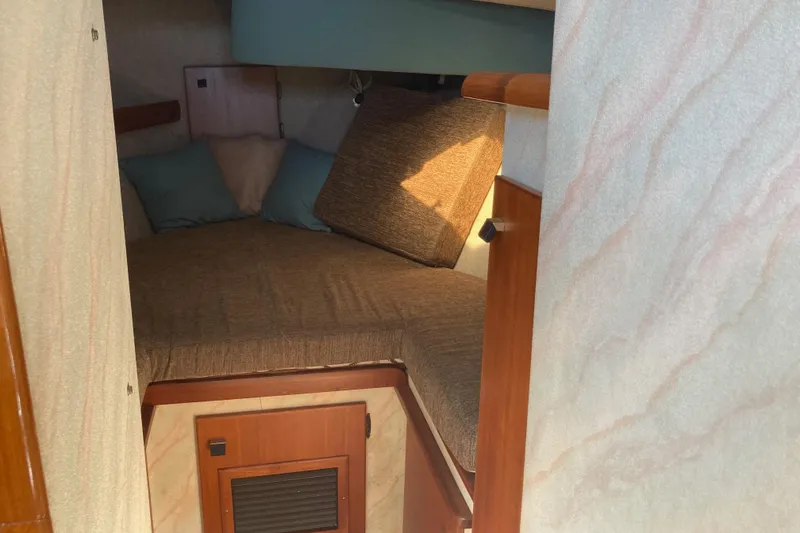 Slide: The Image of 1989 Bayliner 3288 Motoryacht kitchen with microwave and wooden cabinets. - 32