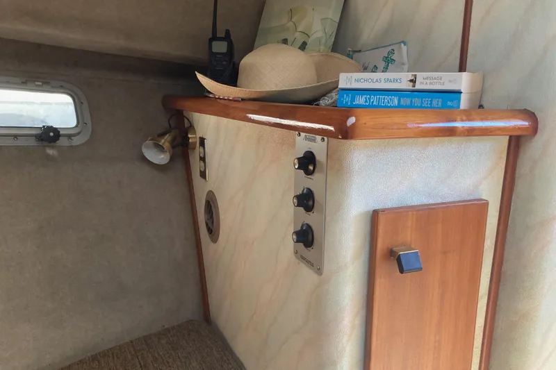 Slide: The Image of 1989 Bayliner 3288 Motoryacht cozy cabin interior with bed and cushions. - 33