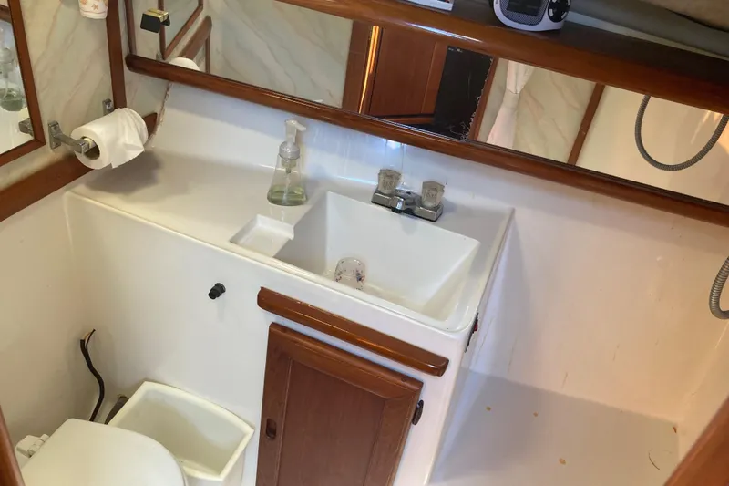 Slide: The Image of Control panel of 1989 Bayliner 3288 Motoryacht with system switch, fan speed, and thermostat. - 35