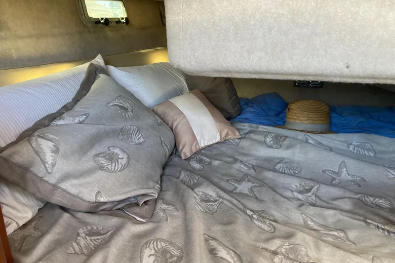 Slide: The Image of Cozy cabin interior of 1989 Bayliner 3288 Motoryacht with bed and wooden cabinetry. - 40