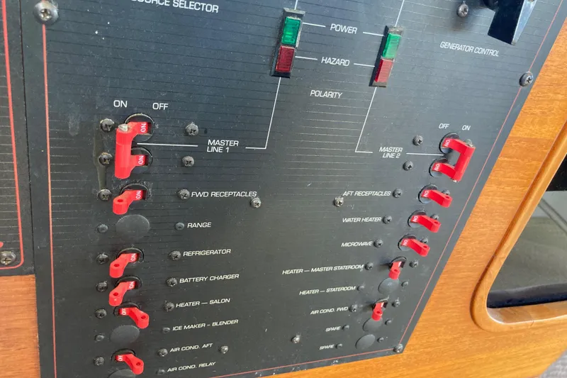 Slide: The Image of Control panel of a 1989 Bayliner 3288 Motoryacht with generator and power switches. - 46