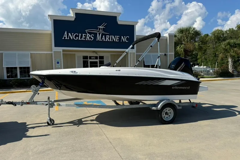 The Image of 2025 Bayliner Element E16 boat on trailer at Anglers Marine NC dealership. - 1