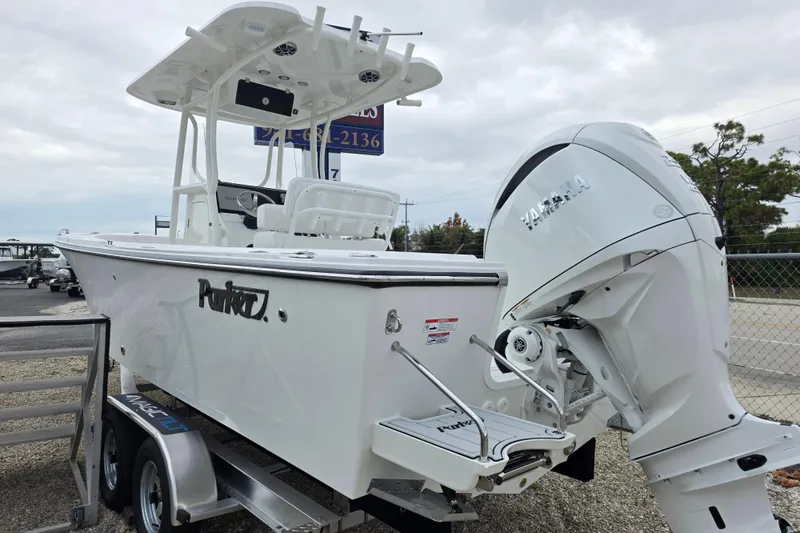 Slide: The Image of 2026 Parker 230 Coastal Elite boat with Yamaha engine on trailer. - 11
