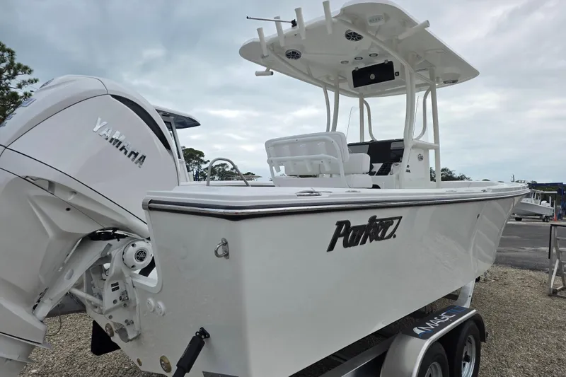 Slide: The Image of 2026 Parker 230 Coastal Elite boat with Yamaha engine, displayed on a trailer. - 12