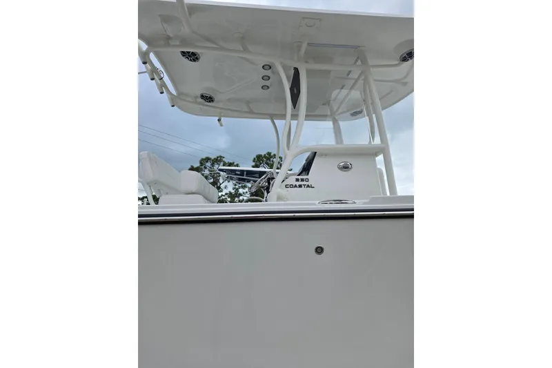 Slide: The Image of 2026 Parker 230 Coastal Elite boat, featuring sleek design and modern amenities. - 13