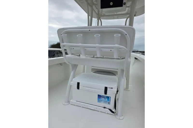 Slide: The Image of 2026 Parker 230 Coastal Elite boat interior with cooler and rod holders. - 22