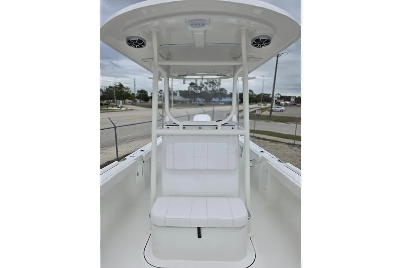 Slide: The Image of 2026 Parker 230 Coastal Elite boat interior with seating and overhead speakers. - 24