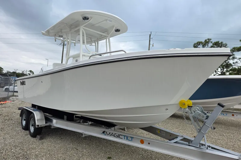 The Image of 2026 Parker 230 Coastal Elite boat on trailer, displayed outdoors under cloudy sky. - 9