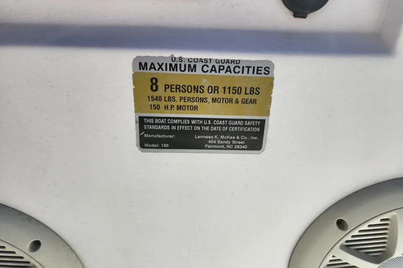 Slide: The Image of 2003 McKee Craft 185 Offshoreman capacity label, 8 persons or 1150 lbs, 150 HP motor. - 11