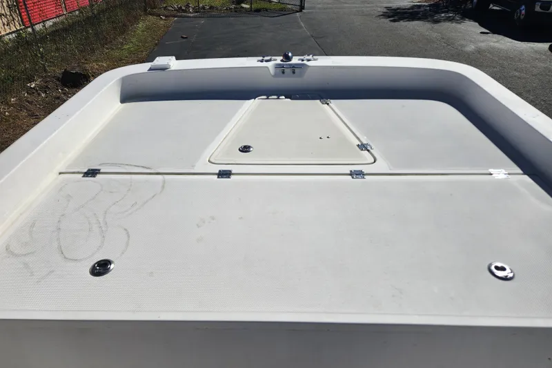 Slide: The Image of 2003 McKee Craft 185 Offshoreman boat deck with storage compartments. - 13