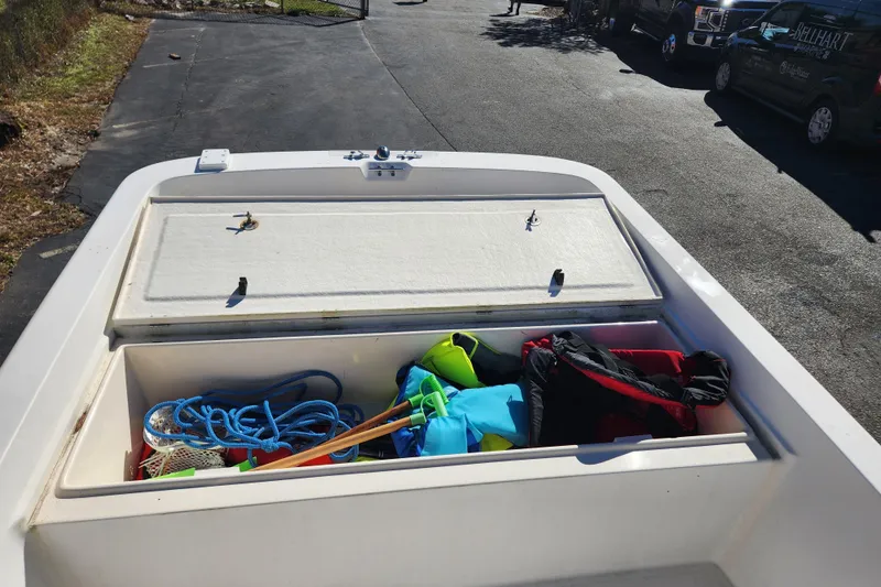 Slide: The Image of 2003 McKee Craft 185 Offshoreman boat storage with ropes and life jackets. - 14