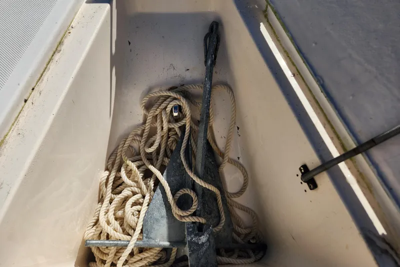 Slide: The Image of Anchor and rope in a 2003 McKee Craft 185 Offshoreman boat compartment. - 15