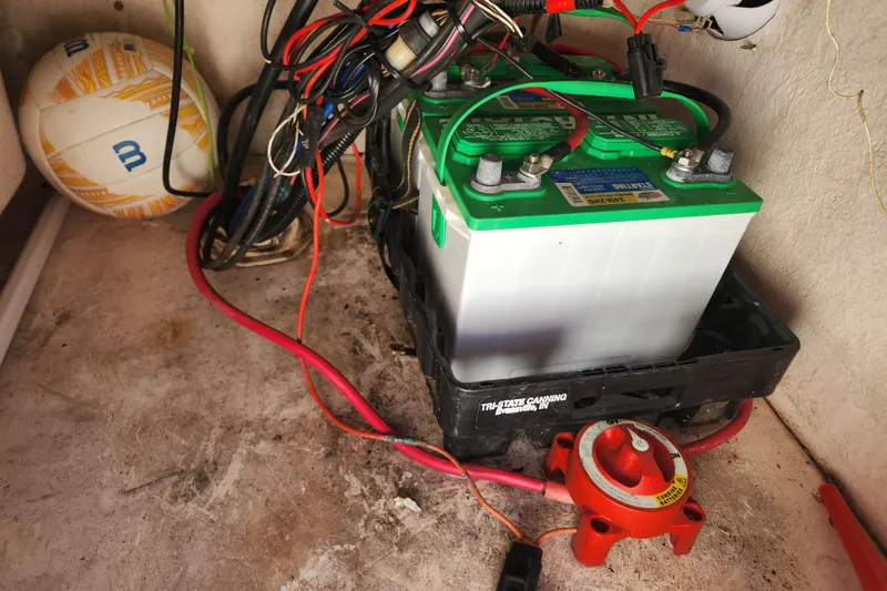 Slide: The Image of Battery setup in a 2003 McKee Craft 185 Offshoreman boat with wiring and switch. - 16