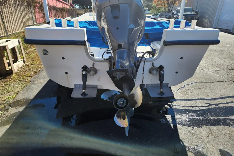 Slide: The Image of 2003 McKee Craft 185 Offshoreman boat with outboard motor, rear view. - 17