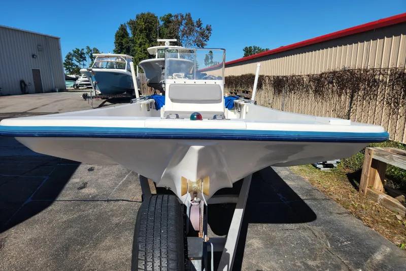 Slide: The Image of 2003 McKee Craft 185 Offshoreman boat on trailer, parked outdoors. - 4