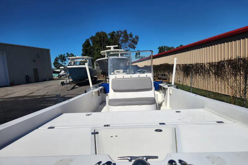 Slide: The Image of 2003 McKee Craft 185 Offshoreman boat in storage yard, clear blue sky. - 5