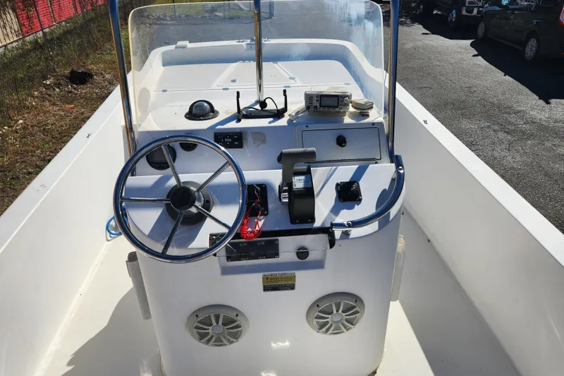 Slide: The Image of 2003 McKee Craft 185 Offshoreman boat console with steering wheel and navigation equipment. - 7