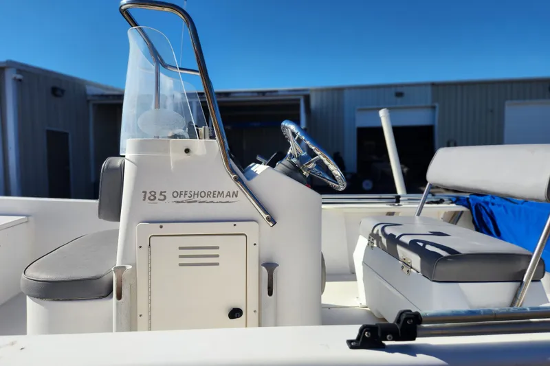 Slide: The Image of 2003 McKee Craft 185 Offshoreman boat interior with steering console and seating. - 8
