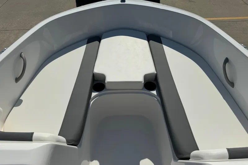 Slide: The Image of 2025 Bayliner Element E16 boat interior with cushioned seating and cup holders. - 6