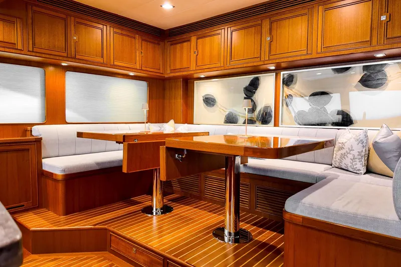 Slide: The Image of Luxurious 2022 Marlow Voyager Series yacht interior with helm, plush seating, and tropical backdrop. - 14