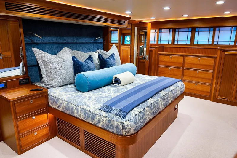 Slide: The Image of Luxurious 2022 Marlow Voyager yacht deck with striped seating and polished fittings. - 6