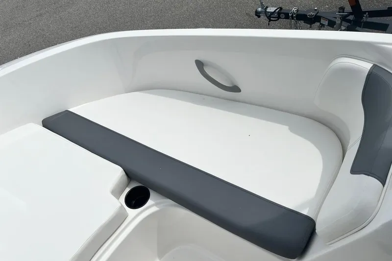 Slide: The Image of 2026 Bayliner Element E16 boat interior with white and gray seating. - 10
