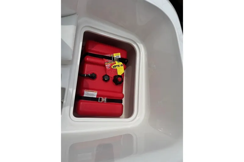 Slide: The Image of Red fuel tank in 2026 Bayliner Element E16 boat storage compartment. - 16