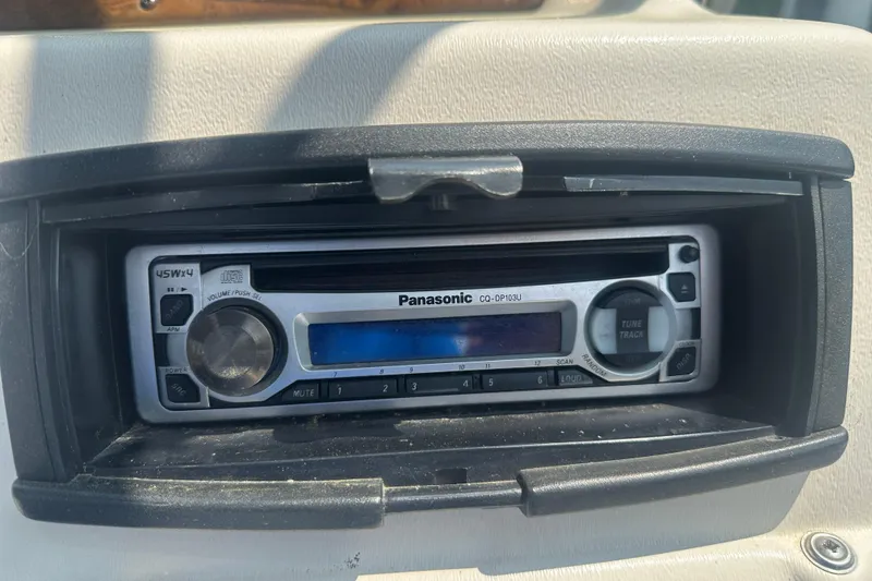Slide: The Image of Panasonic CQ-DP103U stereo in 2004 Crest 20 II LM boat dashboard. - 15