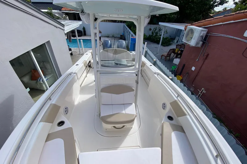 Slide: The Image of 2018 Robalo R242 Center Console boat with spacious seating and modern design. - 14