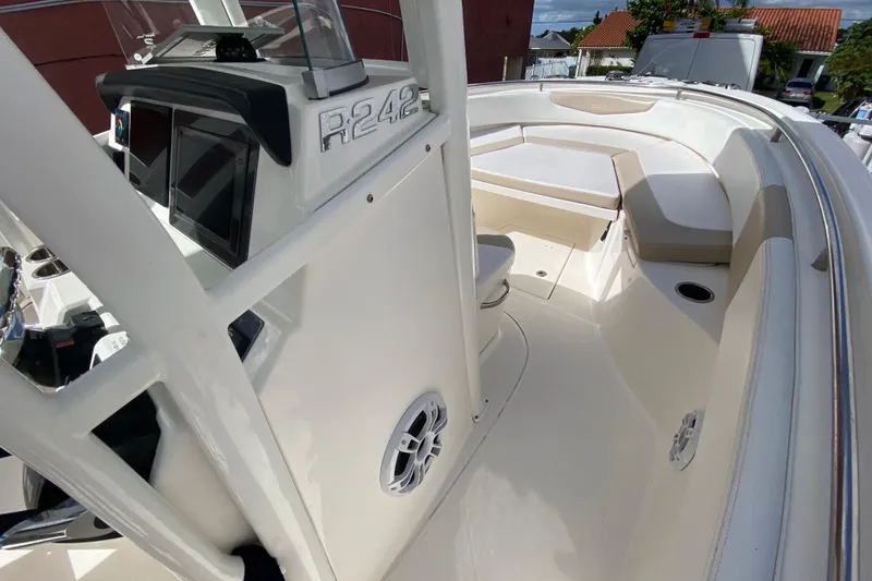 Slide: The Image of 2018 Robalo R242 Center Console boat interior with seating and console view. - 17