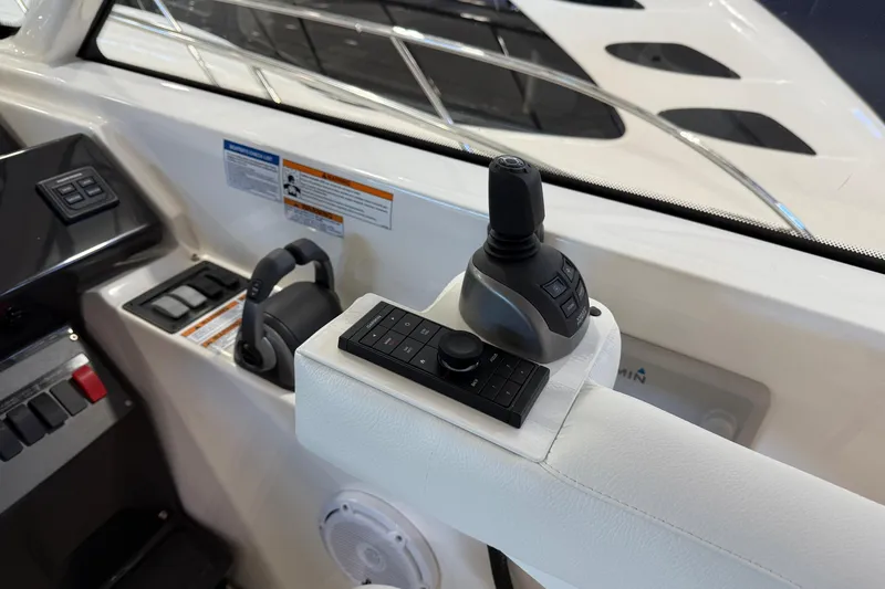 Slide: The Image of Control panel of 2023 Tiara Yachts 43 Open, featuring joystick and navigation controls. - 11