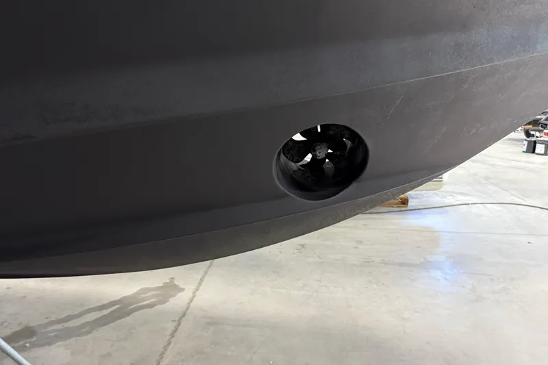 Slide: The Image of 2023 Tiara Yachts 43 Open hull with bow thruster in a workshop. - 22